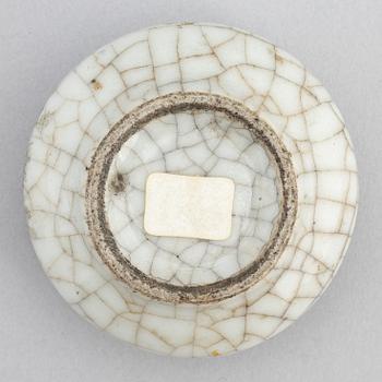 A Chinese celadon glazed lotus leaf shaped bowl, late Qing dynasty, and a ge-glazed brush washer, possibly 20 century.