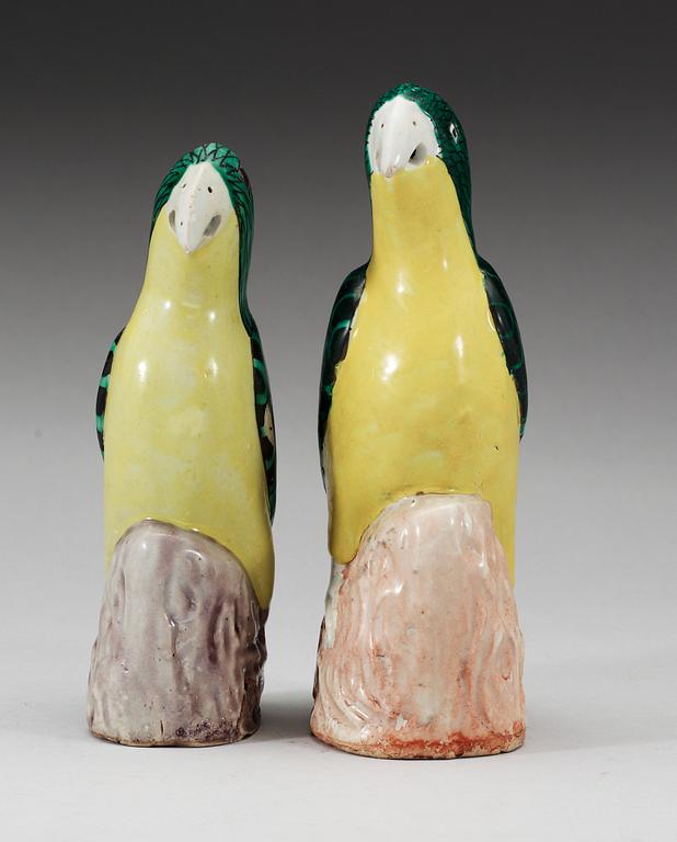 A set of two green and yellow glazed parrots, Qing dynasty, Jiaqing (1796-1820).