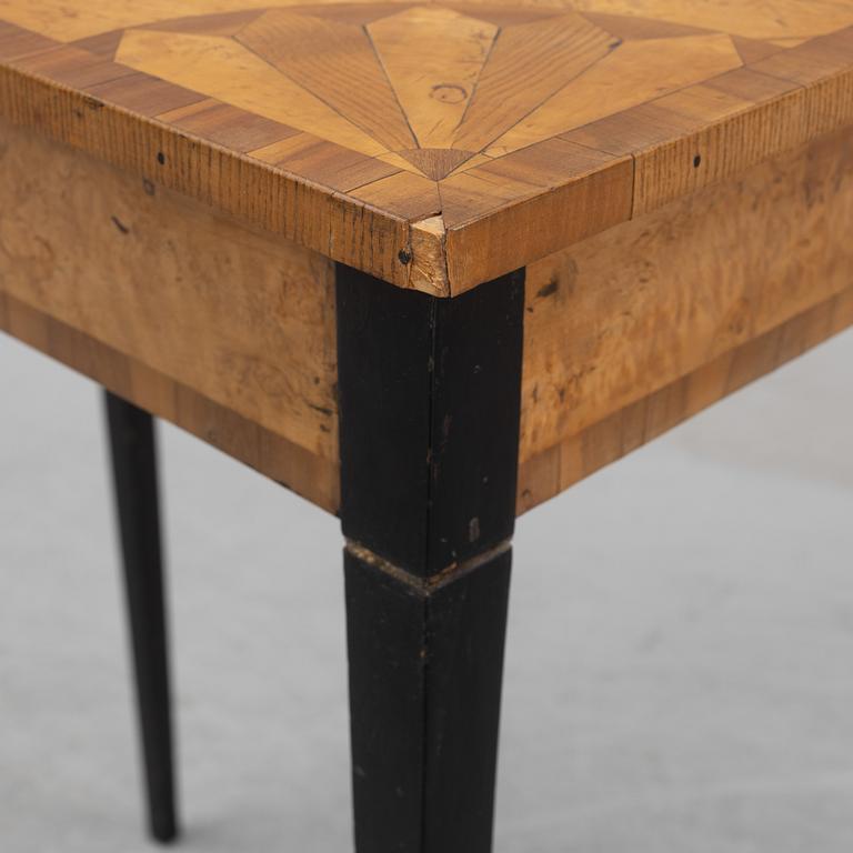 An inlay table, 19th Century.