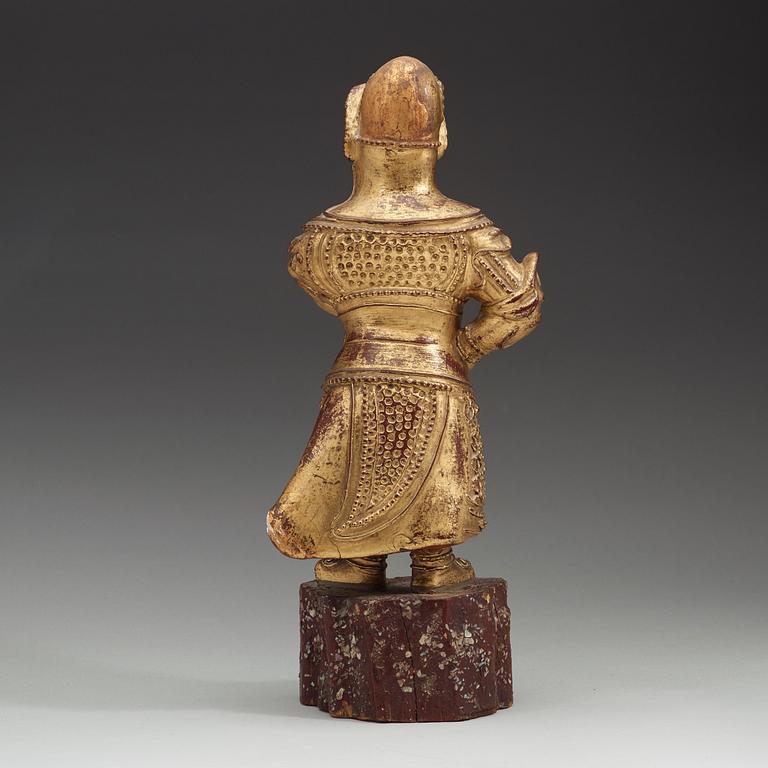 A wood sculpture of a guardian figure, (1644-1912).