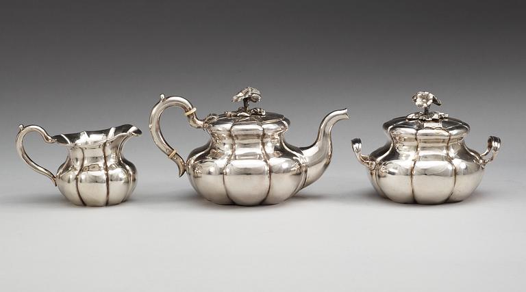 A Russian 19th century parcel-gilt three piece tea-set, makers mark of Carl Siewers, S:t Petersburg 1858.