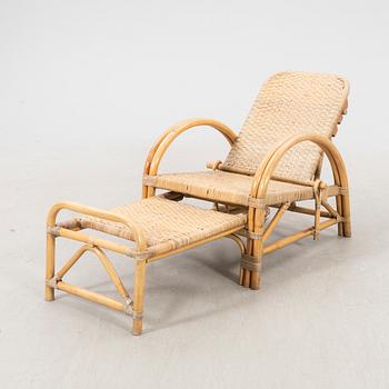 A mid 1900s rattan and bamboo garden chair.