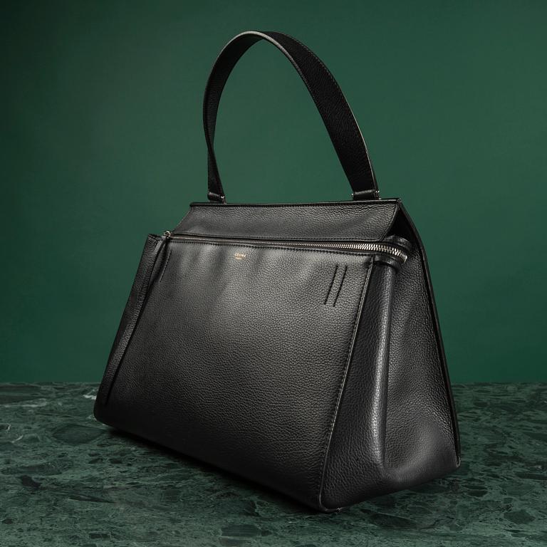 HANDBAG, "Large Edge Bag", Céline, 2013. Black leather with silver-tone hardware, pocket at back with snap closure.