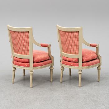 A pair of gustavian style armchairs, second half of the 20th century.
