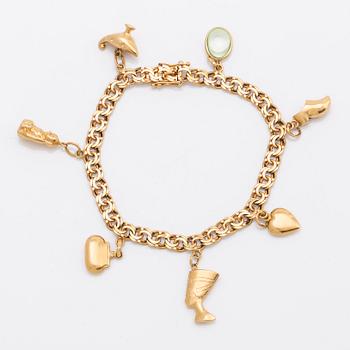 T AHLBERG & CO armband med berlocker 18K guld Stockhlom 1973, total vikt 16 gram.