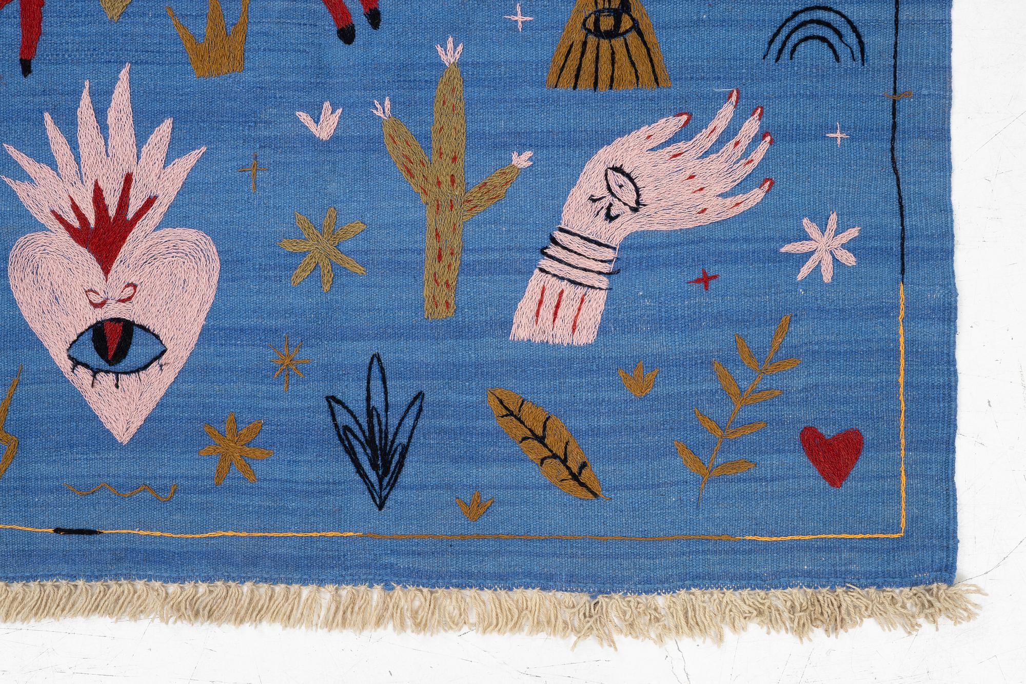 A hand-embroidered Kelim rug, 185 x 124 cm.