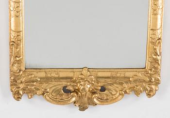 A Rococo mirror, 18th century.