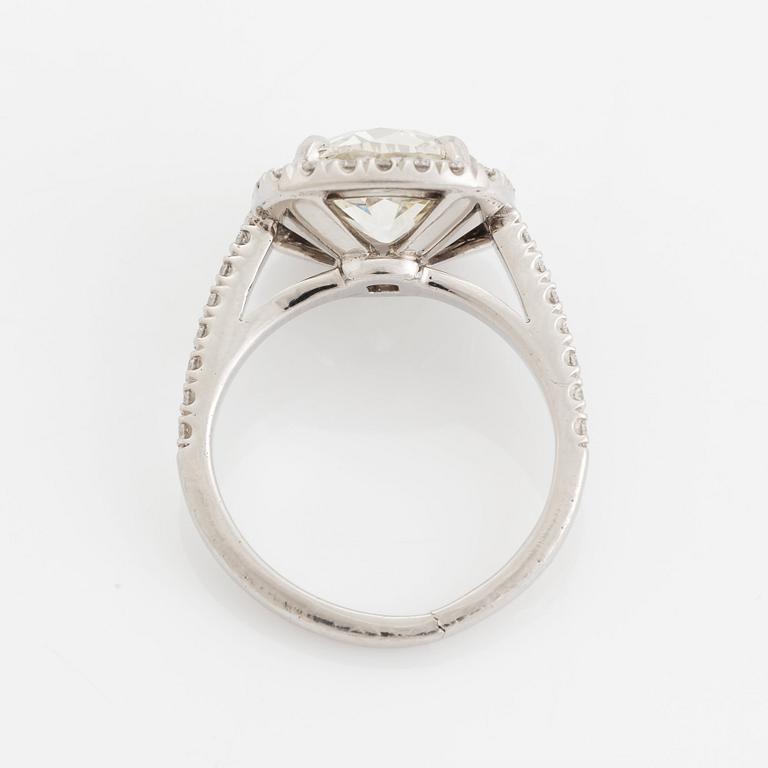 A platinum ring set with a cushion formed old-cut diamond 3.39 cts J vs1 according to accompanying HRD-certficate.