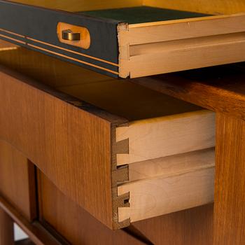 A Danish 1950s-60s cabinet with bar compartment.