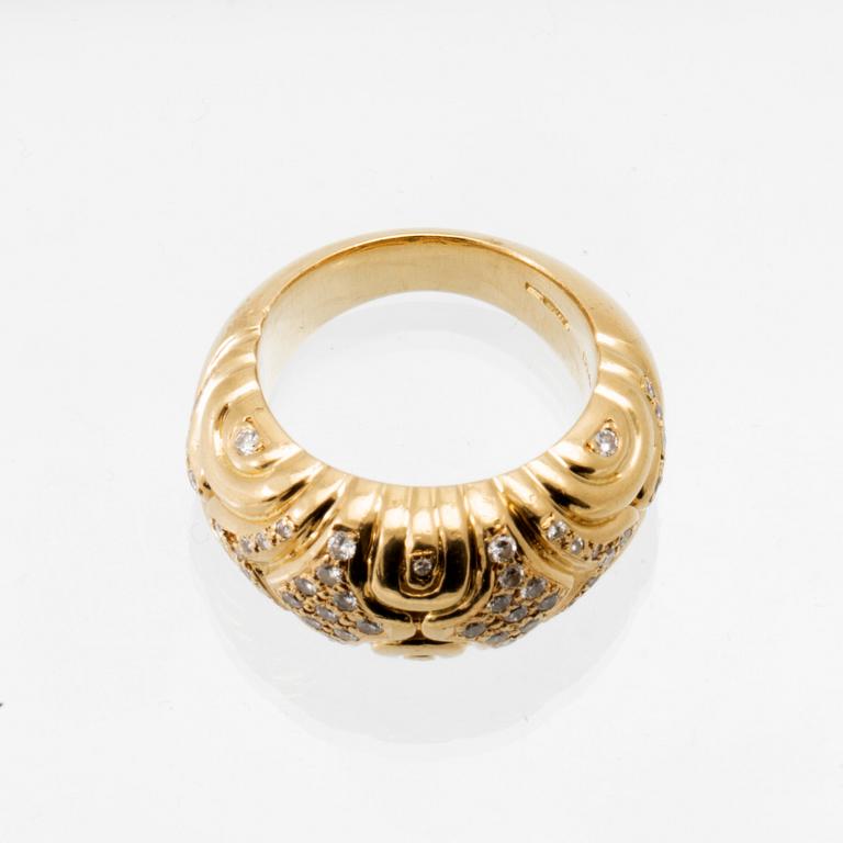An 18K gold ring set with round brilliant-cut diamonds, London.