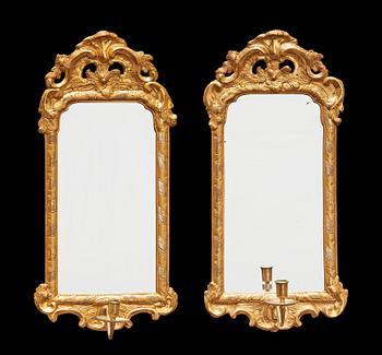 A pair of Swedish Rococo 18th century one-light mirror girandoles.