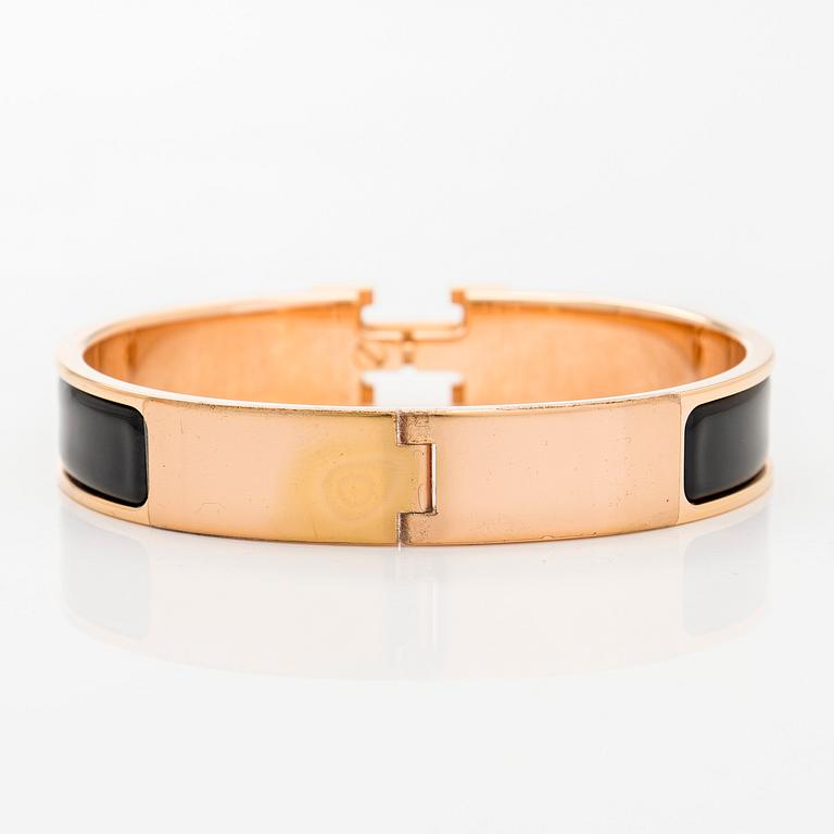 Hermès, a 'Clic H' bracelet.