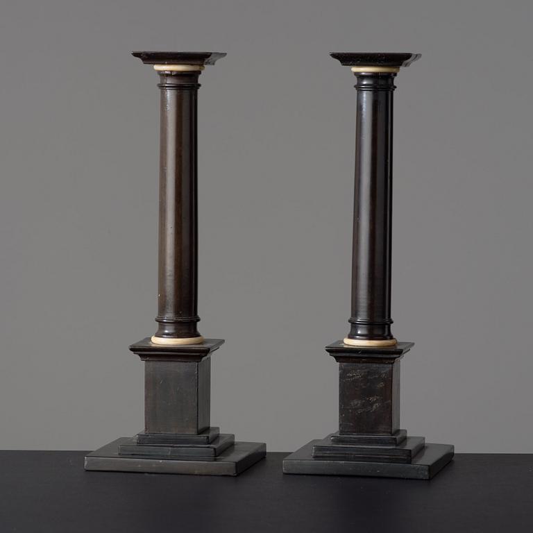 A pair of Empire early 19th century candlesticks.