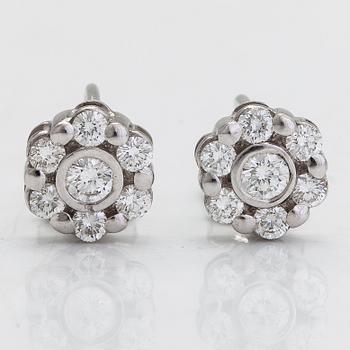 A pair of 18K white gold earrings, with diamonds totalling approximately 0.64 ct.