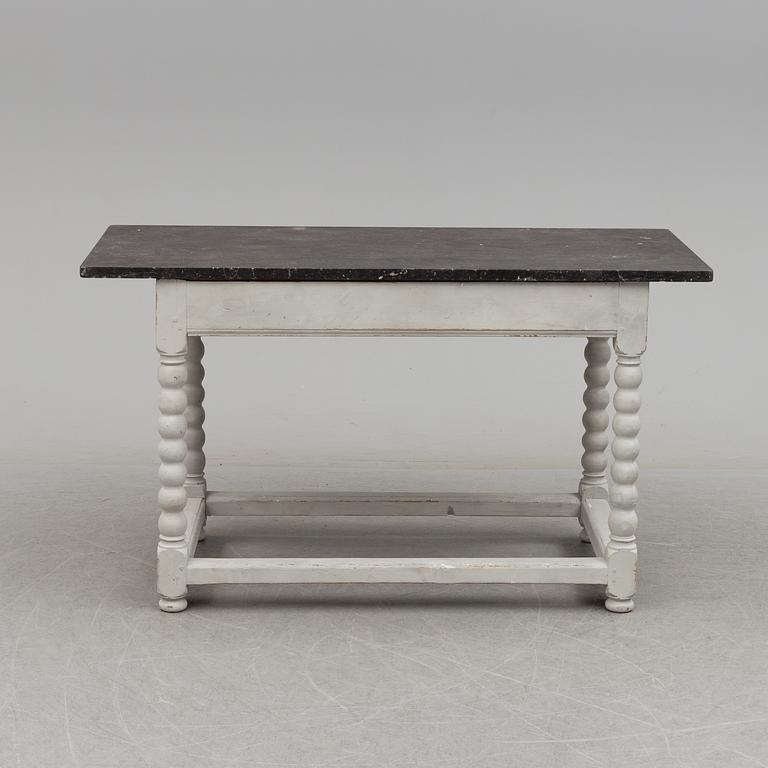 A 19/20th century stone top baroquestyle table.