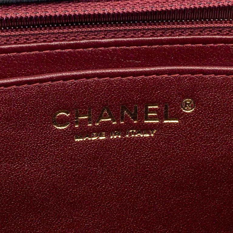 A "Double flap bag maxi" by Chanel 2009-10.