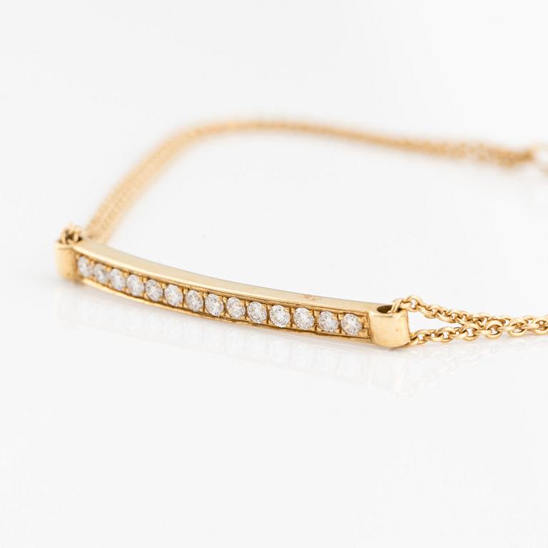 Armband, 18K guld med små briljantslipade diamanter.