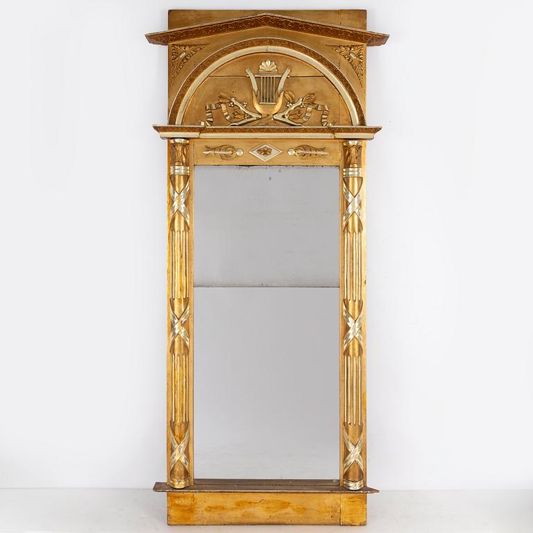 An Empire mirror, first half of the 19th century.