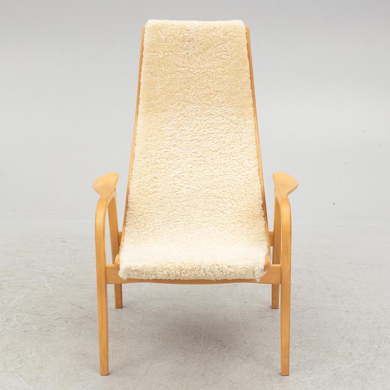 Yngve Ekström, a 'Lamino' armchair and ottoman, Swedese, 2002.