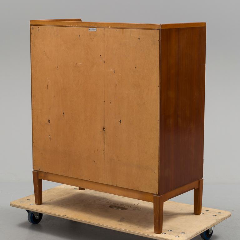 A cabinet by David Rosén for Nordiska Kompaniet dated 1954.