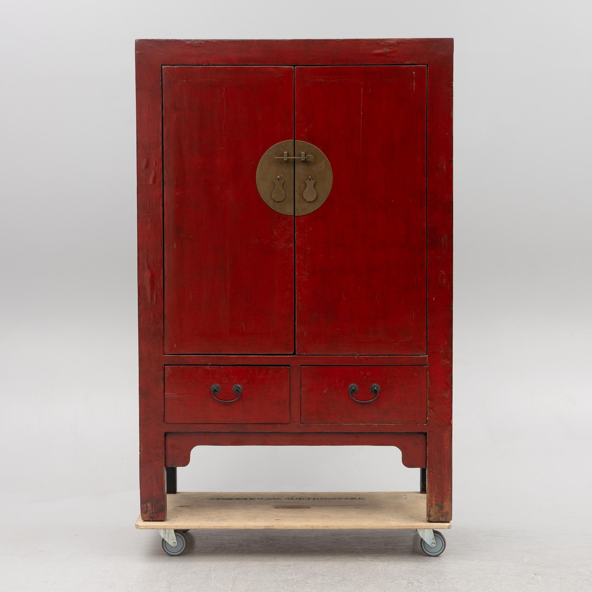 A red-lacquered cabinet, China, 20th century.