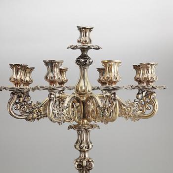 A pair of barocque style nine lights candelabra, silver plate, 20th Century.