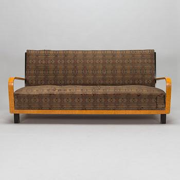 A  1920s Carelian birch veneered sofa.