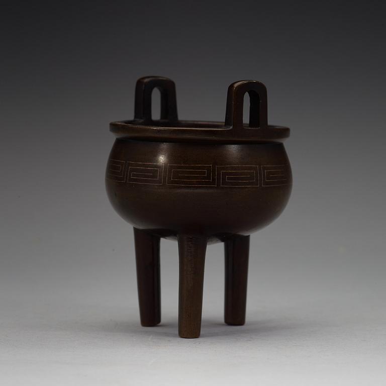 A bronze tripod censer, Qing dynasty, 19th Century with Xuandes six character mark.