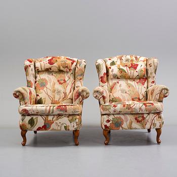 A pair of 20 th century arm chairs.