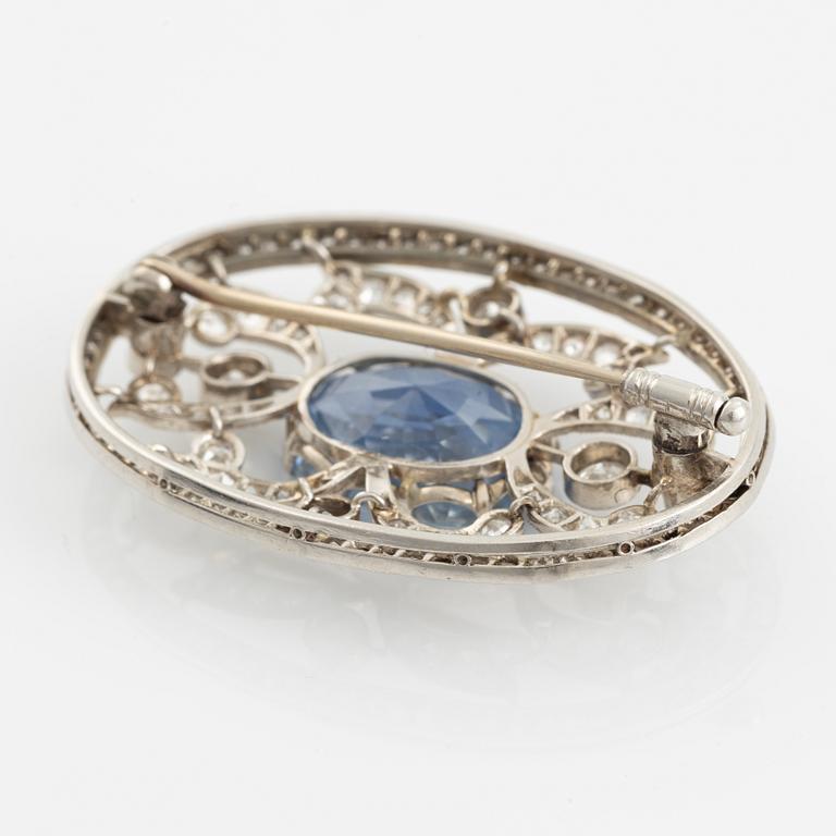 A WA Bolin brooch in platinum set with a faceted sapphire and old- and eight-cut diamonds.