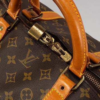 LOUIS VUITTON, a monogram canvas 'Keepall 60' weekend bag.