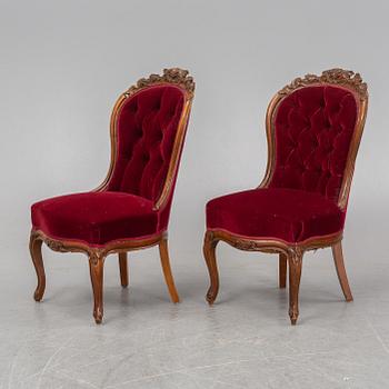 A pair of mahogany Neo-Rococo easy chairs, late 19th Century.