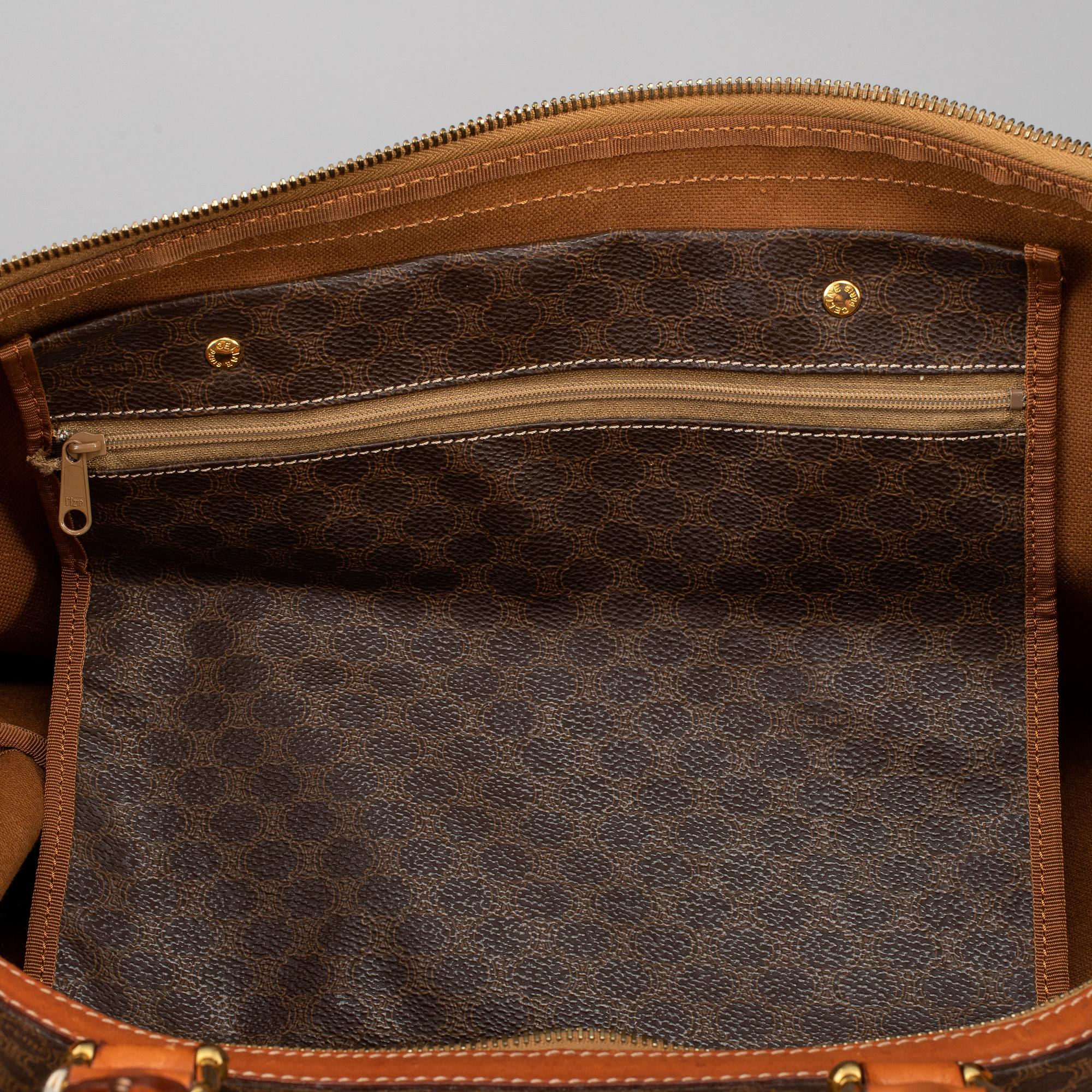 CÉLINE, a 'Macadam Duffle' bag.