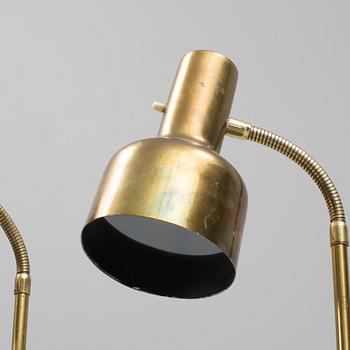 A pair of brass floor lamps, "MAE 27".