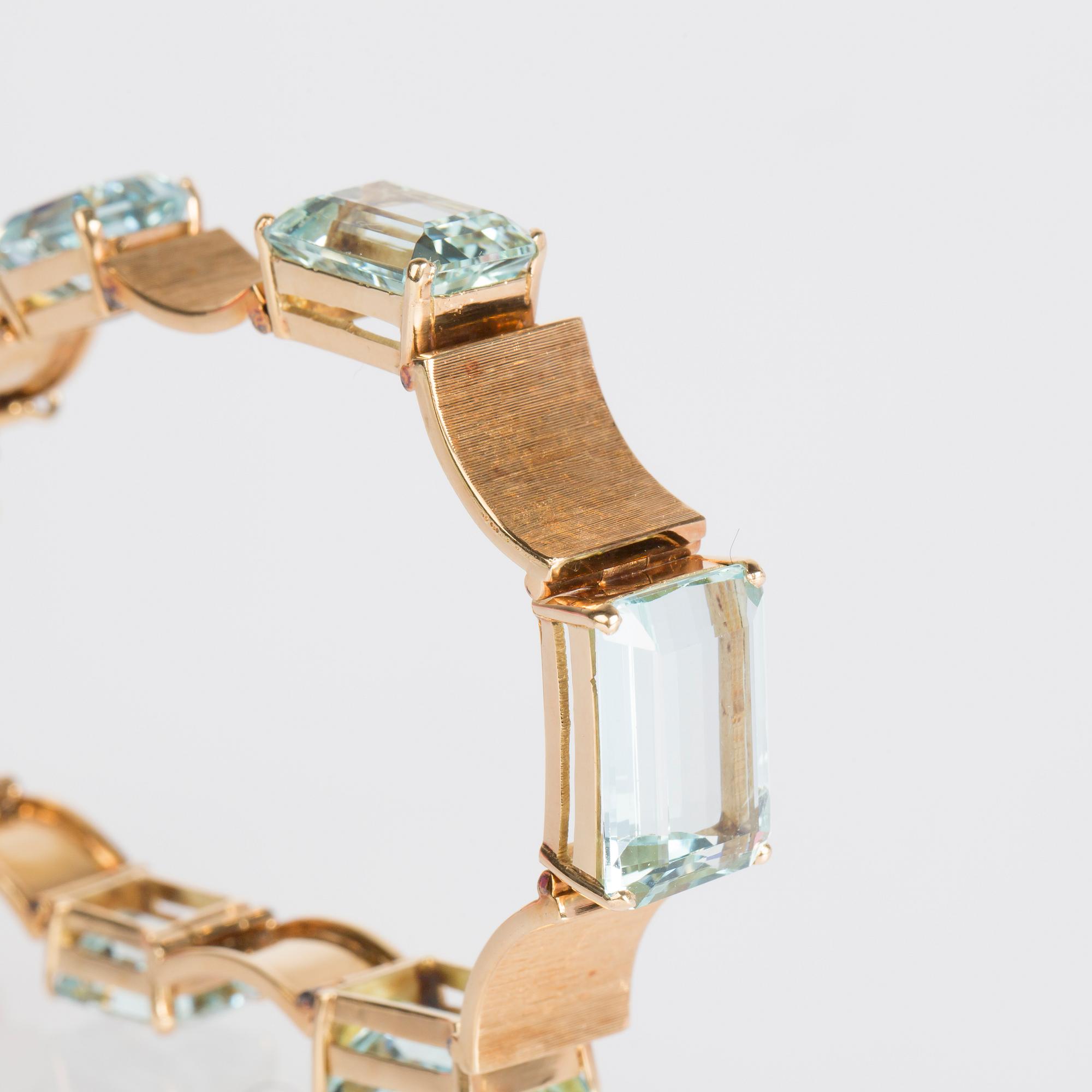 ARMBAND, 14 K guld med trappslipade akvamariner.