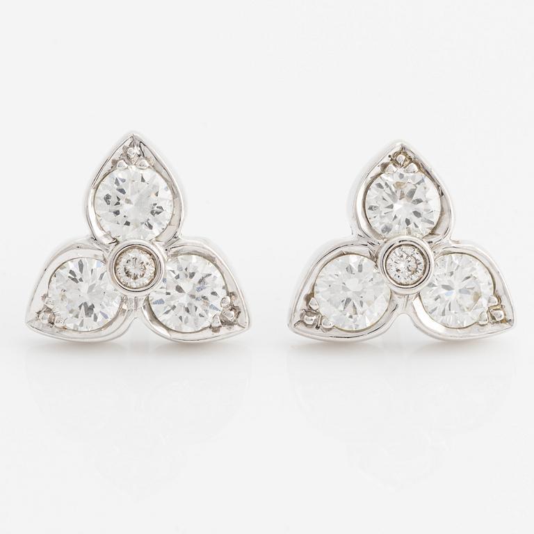 A pair of 18K white gold earrings with round brilliant-cut diamonds.