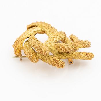 Brosch Hermès 18K guld i form av krans.