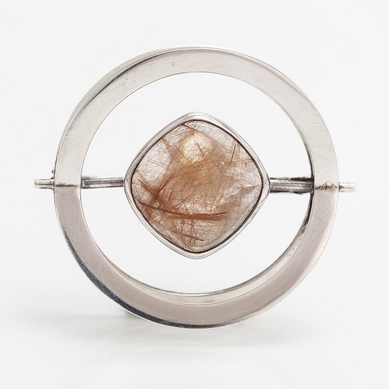 Elis Kauppi, A silver brooch/pendant with a rutile quartz. Kupittaan kulta, Turku 1961.