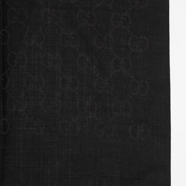 Gucci, a wool and silk mix "GG" jaquard shawl.