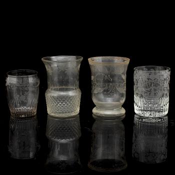 A set of four odd beaker glases, 19th Century.