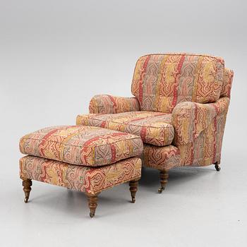 A Howard armchair with ottoman.