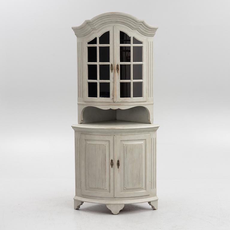 A Gustavian style 20th century corner cabinet.
