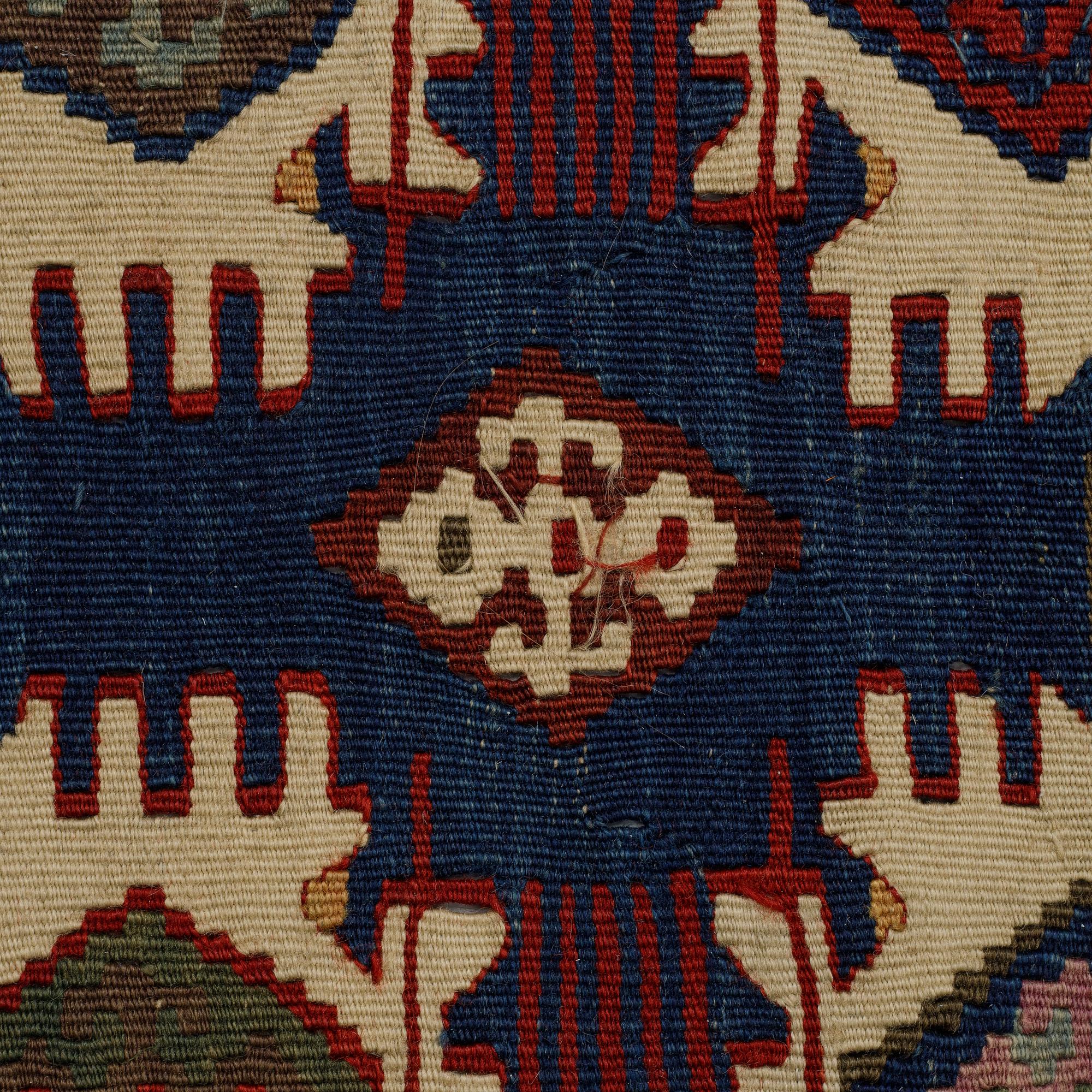 A carpet, a kilim, an antique Anatolian, ca 310-326 x 183,5-192 cm.