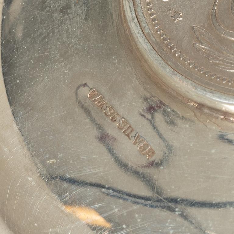 12 silver ashtrays with inlaid coins, silver, Pakistan, mid 20th century.