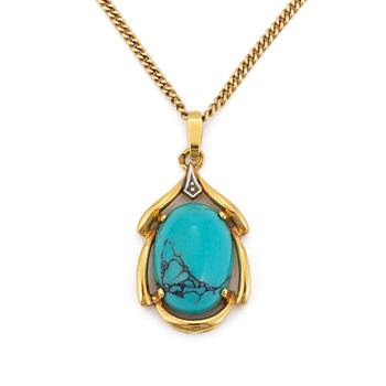A 18K gold turquoise pendant.