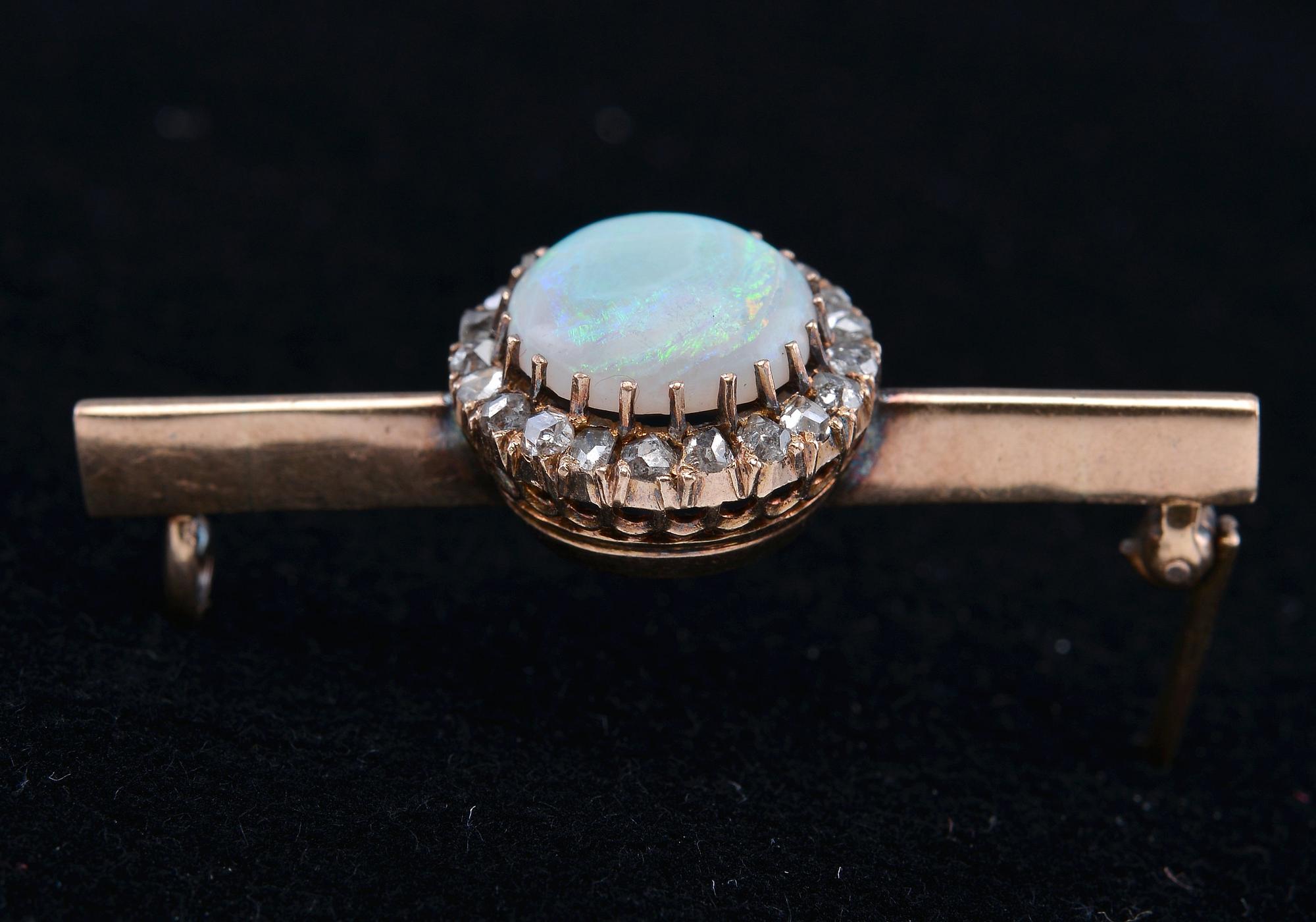 A BROOCH, opal c. 2.5 ct, rose cut diamonds c. 0.2 ct. C.G. Hallberg Stockholm 1875. Weight 5 g.
