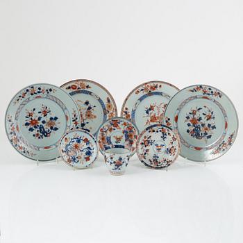 A group of Chinese imari porcelain comprising four plates, three dishes and a cup, Qing dynasty, 18th century.