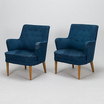 A pair of mid-20th-century armchairs.