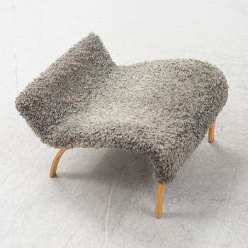 A 'Pernilla' easy chair with stool by Bruno Mathsson for Bruno Mathsson International, dated 2004.