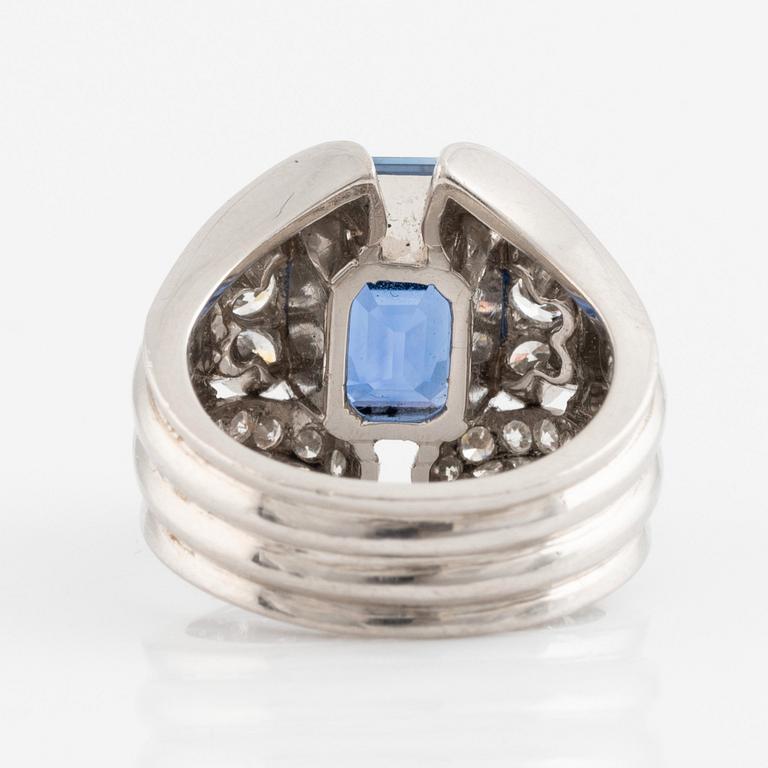 A WA Bolin platinum ring set with a faceted sapphire and old- and eight-cut diamonds.